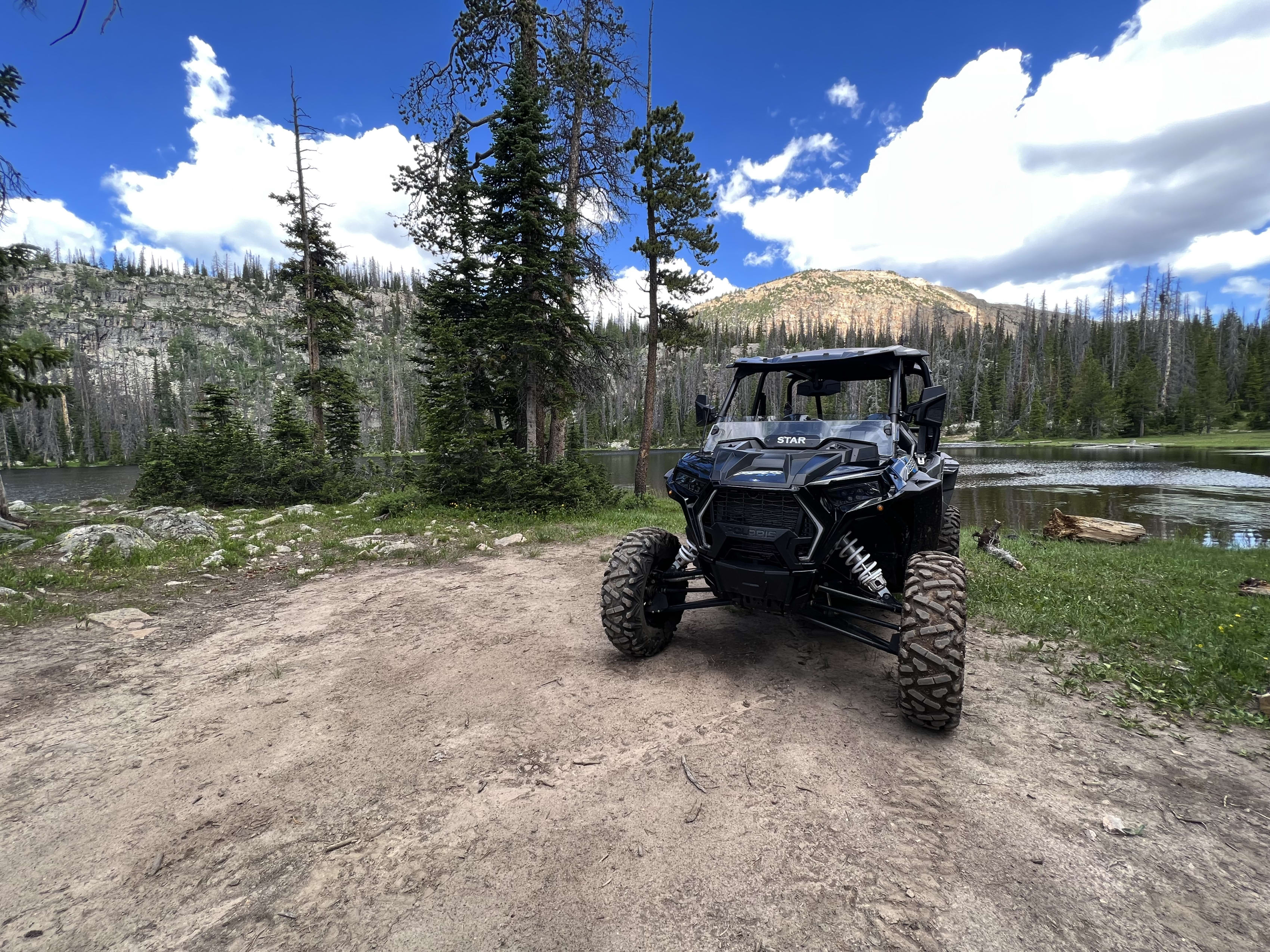 A Polaris side by side traversing boulders near Kamas, Utah